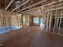 Unfinished living room featuring a view from a window, framing and subfloor at 13159 S Nc-231 Hwy, Middlesex, NC 27557