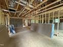 Spacious living room framing with exposed ceiling, drywall, and insulation awaiting the final touches at 13159 S Nc-231 Hwy, Middlesex, NC 27557
