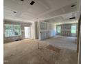 View of a living room under construction showing drywall and multiple windows with exterior views at 13159 S Nc-231 Hwy, Middlesex, NC 27557