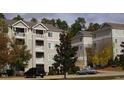 A view of the exterior showing well-maintained landscaping and classic building architecture at 1331 Crab Orchard Dr # 001, Raleigh, NC 27606
