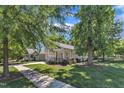 Scenic view of the home nestled in a well-maintained community with lush green lawns at 151 Cobble Ridge Dr, Pittsboro, NC 27312