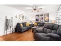 Cozy living room with hardwood floors, neutral walls, and comfortable furnishings at 1703 Keogh St, Burlington, NC 27215