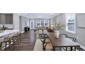 The open living room showcases natural light and transitions into the dining area and kitchen at 1740 Golden Honey Dr, Wake Forest, NC 27587