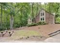 Charming brick and siding home on wooded lot with landscaped front yard at 201 Red Bud Ln, Chapel Hill, NC 27514