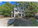 Spacious home with a well-kept lawn, long driveway, and classic architectural design at 24 W Canterbury Ct, Wendell, NC 27591