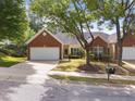 Charming home with a brick and siding exterior, well-manicured lawn, and a two-car garage at 2536 Bent Green St, Raleigh, NC 27614