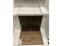 Interior design choices featuring dark wood cabinet, white countertop, and wood look flooring at 331 Chesapeake Cmns St # 106, Garner, NC 27529