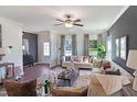 Inviting living room featuring neutral decor, stylish furniture, and abundant natural light at 366 Bunker Hill Place, Angier, NC 27501