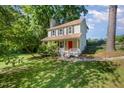 Two-story home with black shutters and a covered front porch at 40 Crepe Myrtle Ct, Angier, NC 27501