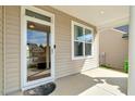 Welcoming front porch featuring a storm door and exterior siding at 4109 Massey Preserve Trl, Raleigh, NC 27616
