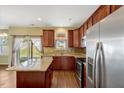 Spacious kitchen with stainless steel appliances, granite counters, and island at 4109 Massey Preserve Trl, Raleigh, NC 27616
