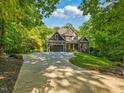 Beautiful home featuring an extra long driveway and well manicured front lawn at 445 Ridge Springs Dr, Chapel Hill, NC 27516