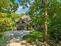 Beautiful home featuring an extra long driveway and well manicured front lawn at 445 Ridge Springs Dr, Chapel Hill, NC 27516