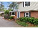 Charming two-story home with brick and siding exterior and well-maintained landscaping at 509 E Millbrook Rd, Raleigh, NC 27609