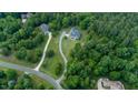 Expansive property surrounded by mature trees, offering privacy and a serene setting on a large lot at 639 Cedar Grove Rd, Pittsboro, NC 27312