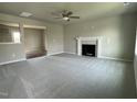 Spacious living room with a fireplace and neutral carpet, ready for new homeowners at 94 Starry Sky Dr, Benson, NC 27504