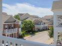 Exterior view of townhomes with well-maintained landscaping, viewed from a balcony at 10529 Sablewood Dr # 116, Raleigh, NC 27617