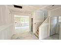 Unfinished home interior showcasing staircase, and multiple windows at 147 Gobbler Dr, Smithfield, NC 27577