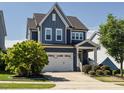 Beautiful two-story home boasts a well-maintained yard and attached two-car garage at 1941 Bright Kannon Way, Wendell, NC 27591