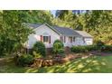 Well-kept home with a lush lawn and decorative red shutters at 205 Smiths Creek Dr, Clayton, NC 27520