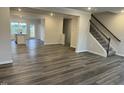 Open-concept living space featuring wood-look floors and an abundance of natural light at 2118 Terrawood Dr, Durham, NC 27703