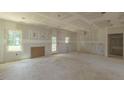Open-concept featuring a large window and a rear door for convenience at 25 Sanders Farm Dr, Smithfield, NC 27577
