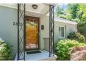 Inviting front entrance with decorative door, porch, and house number at 2823 Fowler Ave, Raleigh, NC 27607