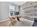 A rustic-chic home office provides a comfortable space for work at 2848 Angelica Rose Way, Apex, NC 27502