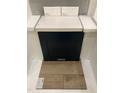 Interior design selection showcasing dark cabinets, light countertops and backsplash, and wood look floors at 323 Chesapeake Cmns St # 104, Garner, NC 27529
