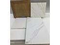 Interior design selection featuring light-stained cabinets, patterned quartz countertop, and coordinating backsplash tiles at 323 Chesapeake Cmns St # 104, Garner, NC 27529