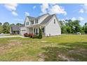 Charming home with a well-maintained lawn, and inviting front porch at 3409 Lemon Springs Rd, Sanford, NC 27332