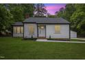 Beautifully renovated home with fresh landscaping and a detached two car garage at 4713 Erwin Rd, Durham, NC 27705