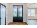 Bright foyer with hardwood floors and stylish front door at 48 Sanders Farm Dr, Smithfield, NC 27577