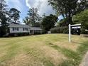 Well-manicured lawn and landscaping welcome you to this charming two-story home at 4813 Glen Forest Dr, Raleigh, NC 27612