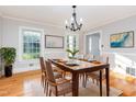 Classic dining room with wood table, hardwood floors and natural light at 5513 Parkwood Dr, Raleigh, NC 27612
