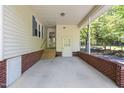 Spacious carport area with access to the home's side entrance and basement at 5517 Spring Rd, Raleigh, NC 27603
