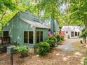 Well-maintained exterior with a fenced yard and lush greenery around the perimeter at 61 Stone Ledge, Pittsboro, NC 27312