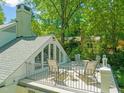 Private balcony with outdoor seating, offering scenic views and a relaxing atmosphere at 612 Swift Ave, Durham, NC 27701