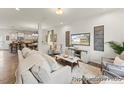 Spacious living room flowing into the kitchen, perfect for entertaining and Gathering gatherings at 69 Curling Creek Dr # I286, Clayton, NC 27527