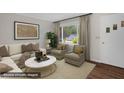 Living room with plush seating, natural light, and stylish decor at 714 W Mckinley St, Mebane, NC 27302