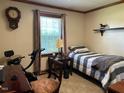 Cozy bedroom with natural light and hardwood floors at 8019 W Tarboro Rd, Rocky Mount, NC 27803
