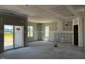 Spacious living room, under construction, with sliding door to backyard at 91 Retreat Run, Smithfield, NC 27577
