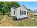 View of the exterior of the house highlighting the side yard and access at 1012 Rainey St, Burlington, NC 27217