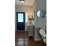 Welcoming foyer featuring hardwood floors, decorative mirror, and elegant furnishings at 102 Kipling Dr, Oxford, NC 27565