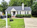 A charming home with a well-maintained front yard and a mailbox displaying the house number at 106 Grange Dr, Wendell, NC 27591