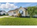 A well-maintained single-story home with green lawn and attached garage in a peaceful neighborhood at 108 Hudson Dr, Princeton, NC 27569