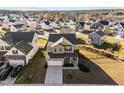 Aerial view showcasing the two-story home in a well-planned neighborhood with manicured lawns at 1236 Shadow Shade, Wake Forest, NC 27587