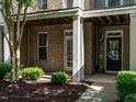 Close-up of a brick townhome entrance showcasing a well-maintained exterior and inviting doorway at 1314 Cornell Pl, Raleigh, NC 27607