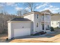Charming home with a two-story porch, attached garage and low maintenance landscaping at 187 Ashley Woods Ct, Clayton, NC 27527