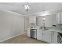 Elegant kitchen featuring stainless steel appliances, white cabinets, and marble countertops at 20 Meadowcrest Dr, Durham, NC 27703